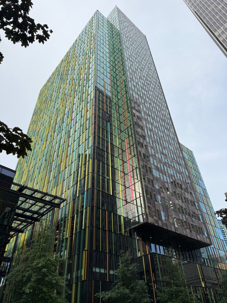 Image of a modern, colorful building in Seattle, showcasing a mix of glass and steel architecture.